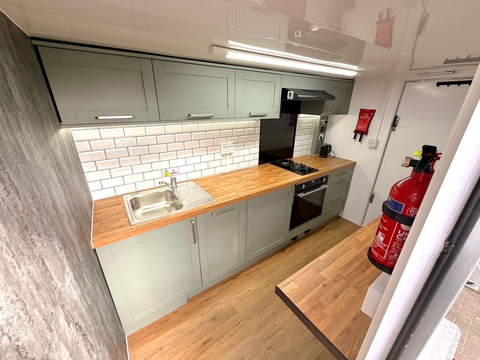 Pod interior with fridge-freezer and breakfast bar seating